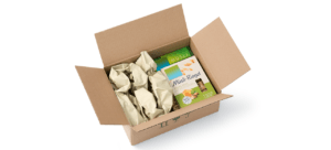 colis de boite de céréale dans un emballage carton avec papier de calage